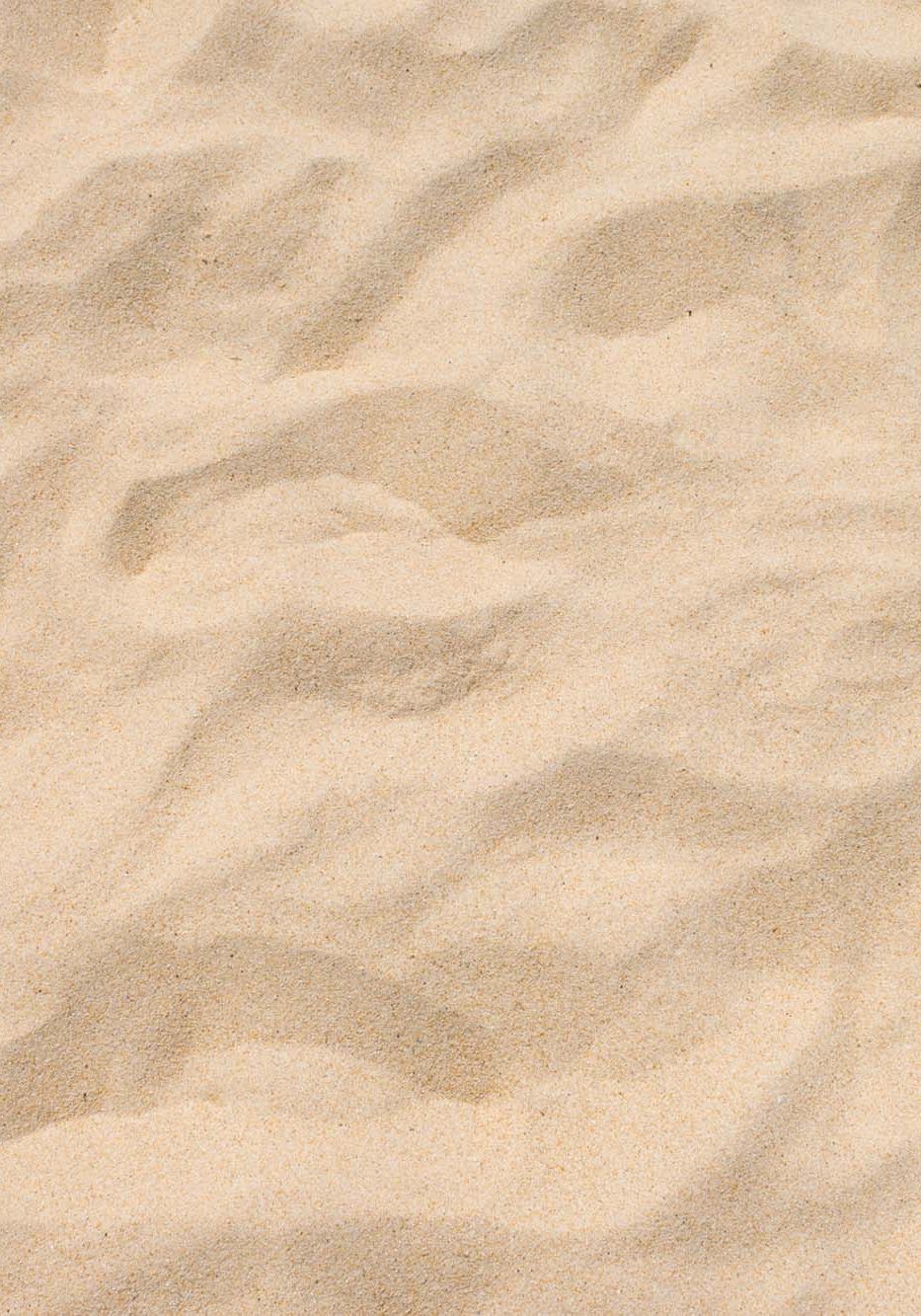 Fine beach sand in the summer sun.
